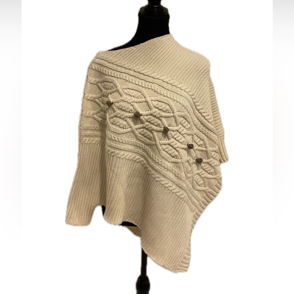 Just in time for a sweater, weather cream cable poncho with  3/4 Sleeves .